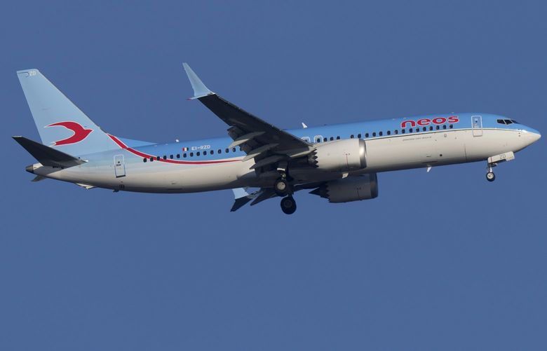 A Italian airline Neos Boeing 737 MAX 8 approaches for landing in Lisbon early in the morning, Saturday, May 7, 2022. (AP Photo/Armando Franca) XAF XAF
