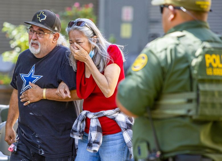 A woman cries as she leaves the Uvalde Civic Center, Tuesday May 24, 2022, in Uvalde, Texas An 18-year-old gunman opened fire Tuesday at a Texas elementary school, killing multiple children and a teacher and wounding others, Gov. Greg Abbott said, and the gunman was dead. (William Luther / The San Antonio Express-News via AP)