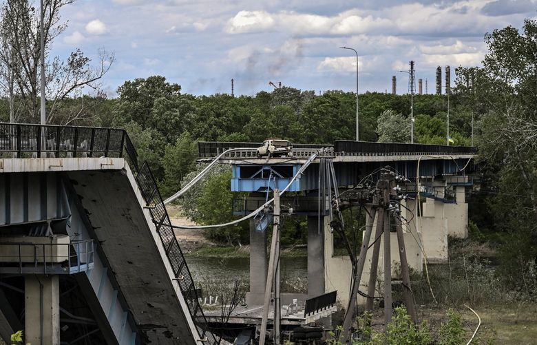 The destroyed bridge connecting the city of Lysychansk with the city of Severodonetsk in the eastern Ukranian region of Donbass, amid Russian invasion of Ukraine, on Sunday, May 22, 2022. (Aris Messinis/AFP/Getty Images/TNS) 48709559W 48709559W