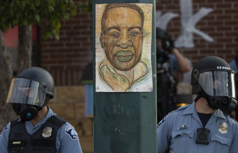 FILE – Minneapolis police stand outside the department’s 3rd Precinct on May 27, 2020, in Minneapolis. President Joe Biden plans to sign an executive order on policing on Wednesday, the second anniversary of George Floyd’s death. That’s according to three people familiar with the matter who spoke on condition of anonymity to preview the matter. The executive order includes changes to policies on use of force and restrictions on the flow of surplus military hardware to local police. (Carlos Gonzalez/Star Tribune via AP, File) MNMIT501 MNMIT501