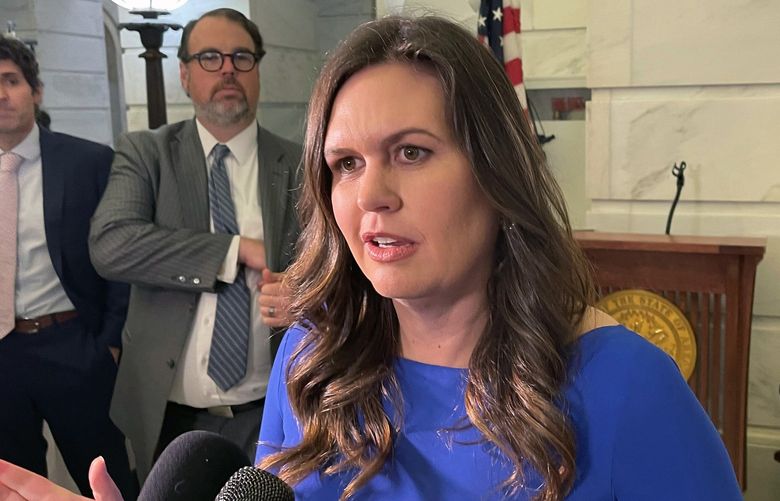 FILE – Arkansas Republican Gubernatorial candidate Sarah Sanders talks to reporters at the Arkansas state Capitol in Little Rock, Ark. on Feb. 22, 2022 after filing paperwork to run for governor. She is running in the Republican primary on May 24, 2022. (AP Photo/Andrew DeMillo) RPAD601 RPAD601