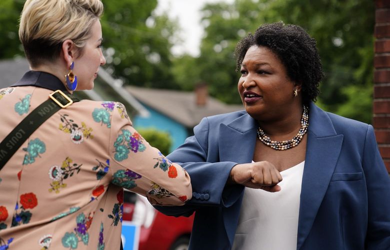 Georgia Democratic gubernatorial candidate Stacey Abrams greets a supporter during Georgia’s primary election on Tuesday, May 24, 2022, in Atlanta. (AP Photo/Brynn Anderson) GABA133 GABA133