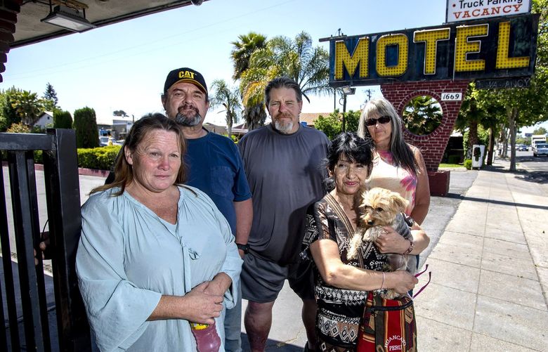 A group of homeless people that once camped on property owned by Apple — Deborah Kempkoble, Gary Nadeau, Rich Bebee, Bertha Iglesias and Ana Vazquez — are in their final week of a nine-month stay paid for by the tech company at a motel in San Jose, Calif., Tuesday, March 17, 2022. (Karl Mondon/Bay Area News Group/TNS) 48639983W 48639983W