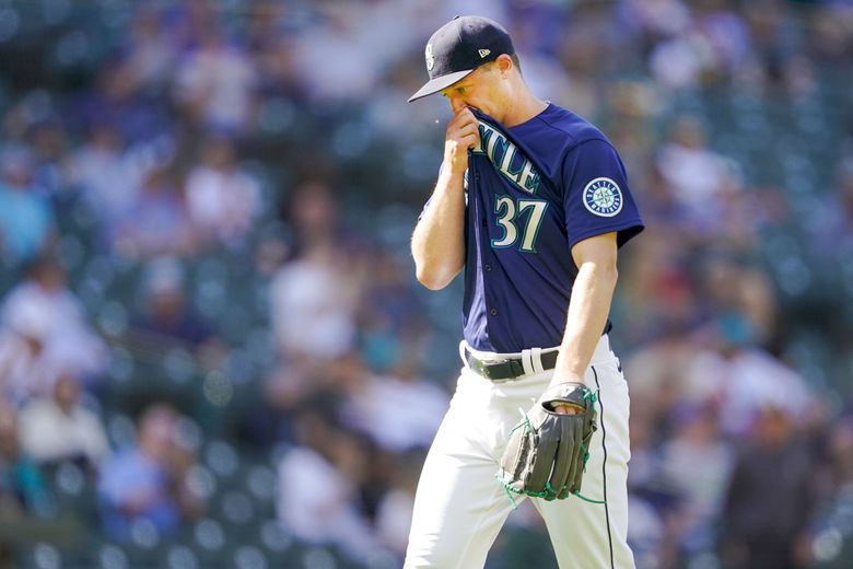 Seattle Mariners closing pitcher Paul Sewald walks off the mound after the top of the ninth inning where he gave up one run to the Athletics. The A’s won 4-2, sweeping the series, as the Mariners sunk to last place. (Ted S. Warren / AP)