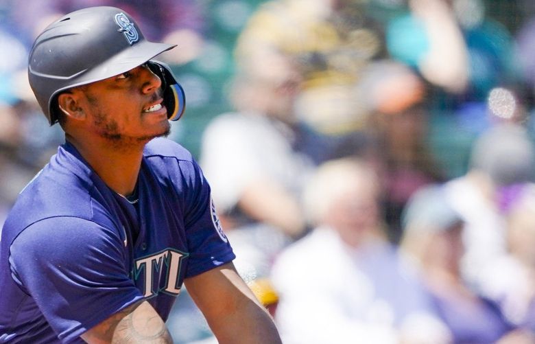 Seattle Mariners’ Kyle Lewis watches his line-out during the second inning of a baseball game against the Oakland Athletics, Wednesday, May 25, 2022, in Seattle. (AP Photo/Ted S. Warren) WATW106