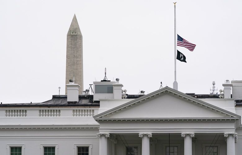 The flags fly at half-staff over the White House by order of President Joe Biden, Wednesday, May 25, 2022, in Washington. (AP Photo/Alex Brandon) DCAB101 DCAB101