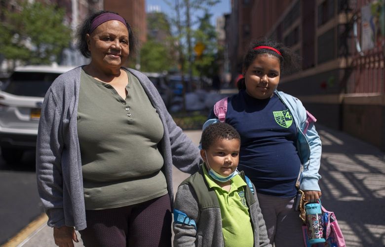 Luz Belliard, her granddaughter Victoria Alverez, 9, and a cousin of her daughter outside Public School 4 in New York, May 25, 2022. A day after a gunman massacred 19 children in a classroom in Uvalde, Texas, parents and caregivers all over the country grappled once again with a troubling question: Are our children safe at school? (Gregg Vigliotti/The New York Times) XNYT178 XNYT178