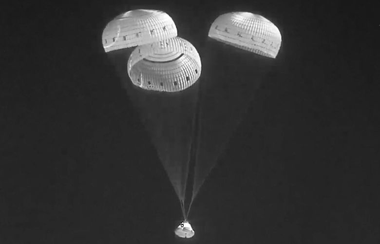 In this infrared image from video made available by NASA, the Boeing Starliner capsule uses parachutes as it descends to land at the White Sands Missile Range in New Mexico on Wednesday, May 25, 2022. (NASA via AP) NASA101 NASA101
