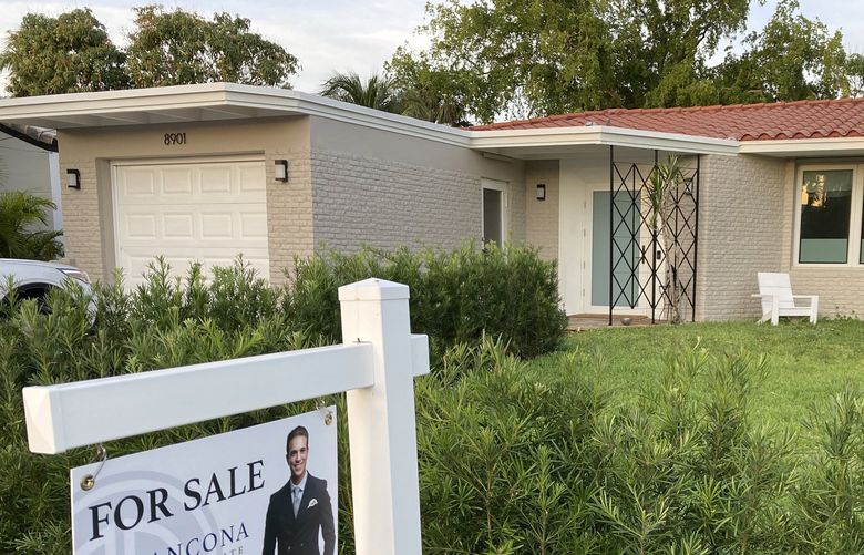 FILE – A home with a “Sold” sign is shown, Sunday, May 2, 2021, in Surfside, Fla. (AP Photo/Wilfredo Lee, File) 
