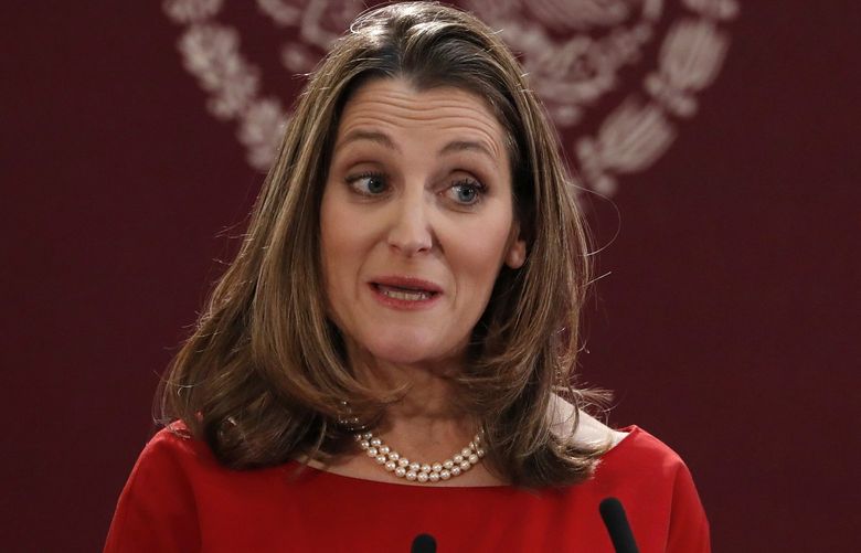 FILE – Deputy Prime Minister of Canada Chrystia Freeland speaks during an event to sign an update to the North American Free Trade Agreement, at the national palace in Mexico City, Dec. 10. 2019. Western allies are considering whether to allow Russian oligarchs to buy their way out of sanctions and using the money to rebuild Ukraine, according to government officials familiar with the matter. Canadian Deputy Prime Minister and Finance Minister Chrystia Freeland proposed the idea at a G-7 finance ministers’ meeting in Germany last week. (AP Photo/Marco Ugarte, file) LLT106 LLT106