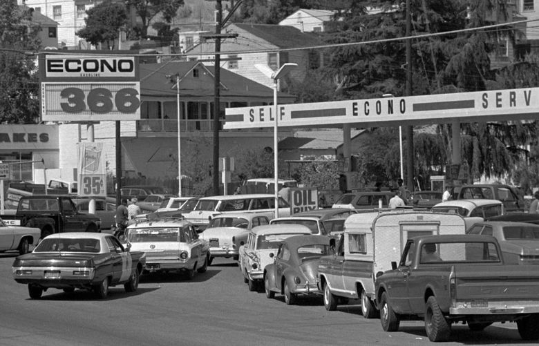 FILE – Cars line up for gas at a gas station in Martinez, Calif., on Sept. 21, 1973. An unhappy confluence of events has economists reaching back to the days of disco and the bleak high-inflation, high-unemployment economy of nearly a half century ago. No one thinks stagflation is in sight. But as a longer-term threat, it can no longer be dismissed.(AP Photo/File) NYSB333 NYSB333