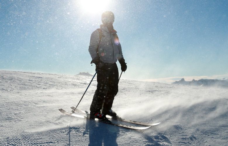 As winds blow snow, skiers navigate Crystal Mountain ski resort Wednesday, December 2, 2020.    216589