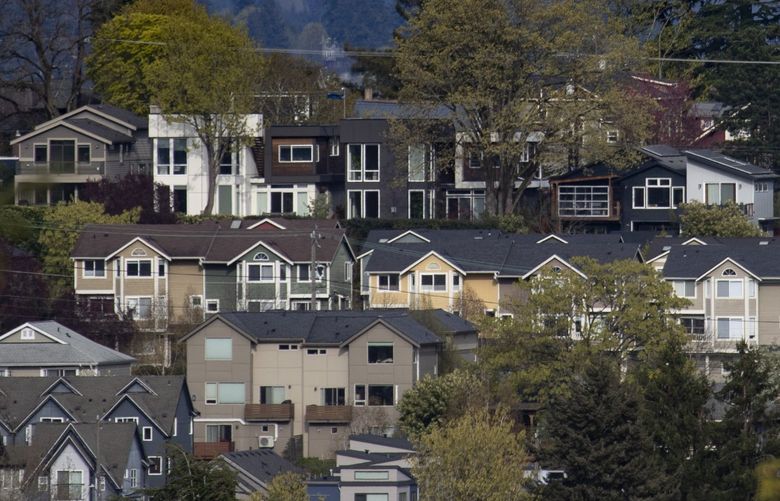 Homes are seen between Seattle’s Central District and Judkins Park neighborhoods, Sunday, April 10, 2022, as viewed looking east from north Beacon Hill. 220091