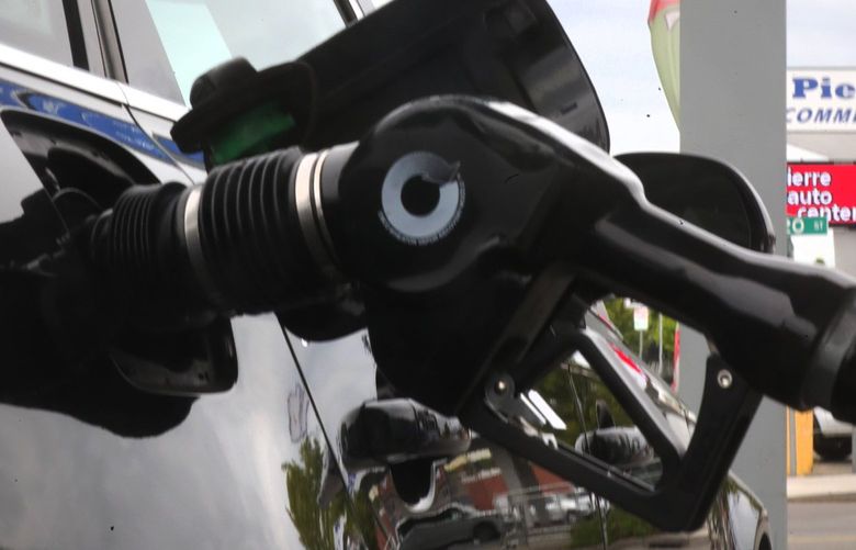 Joshua Owens fills his Audi at a Chevron station on Lake City Way, Thursday May 26, 2022. Prices are still heading upward, close to $6.00/gallon. 220501
