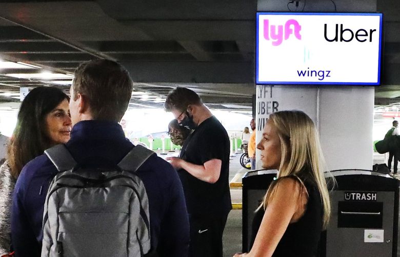 Travelers returning to SeaTac International Airport wait for their rideshare on level three of the parking garage served by Uber, Lyft and Wingz.  These are mobile apt- based transport.   An Uber ride from the airport to downtown Seattle was about $45.  The fare into Seattle is around $3.00 depending on distance traveled on Link light rail.

Thursday June 17, 2021.
Seattle-Tacoma Int’l Airport 217431