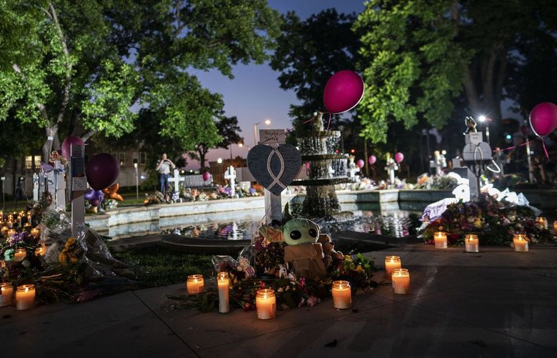Candles are lit at dawn at a memorial site in the town square for the victims killed in this week’s elementary school shooting on Friday, May 27, 2022, in Uvalde, Texas. (AP Photo/Wong Maye-E) NYWM101 NYWM101