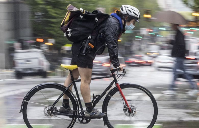 May 12, 2022. Lines Only LO. It’s raining, it’s pouring, it’s time to ride a bike on the slick roads of downtown Seattle. 220394