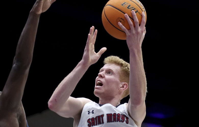 Saint Mary’s guard Jabe Mullins (5) shoots against San Diego guard Marcellus Earlington (10) during the second half of an NCAA college basketball game in Moraga, Calif., Thursday, Feb. 10, 2022. (AP Photo/Jed Jacobsohn)
