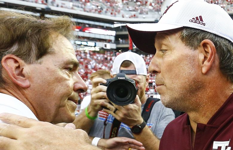 FILE – Alabama head coach Nick Saban shakes hands with Texas A&M head coach Jimbo Fisher after the end of an NCAA college football game, Saturday, Sept. 22, 2018, in Tuscaloosa, Ala. Texas A&M coach Jimbo Fisher called Nick Saban a “narcissist†Thursday, May 19, 2022, after the Alabama coach made “despicable†comments about the Aggies using name, image and likeness deals to land their top-ranked recruiting classes. Saban called out Texas A&M on Wednesday night for “buying†players. (AP Photo/Butch Dill, File) NY158 NY158