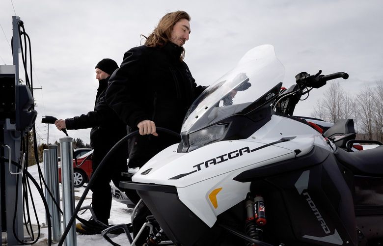 FILE â€” Battery-powered snowmobiles produced by Taiga Motors at a charging port in Saint-Paulin, Quebec, Canada, on March 29, 2022. While electric cars get most of the attention, electric lawn mowers, boats, bicycles, scooters and all-terrain vehicles are proliferating. (Nasuna Stuart-Ulin/The New York Times)
 XNYT47 XNYT47