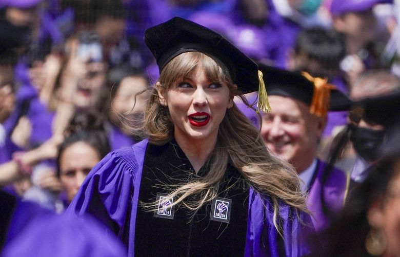 Taylor Swift participates in a graduation ceremony for New York University at Yankee Stadium in New York, Wednesday, May 18, 2022. (AP Photo/Seth Wenig) NYSW106 NYSW106