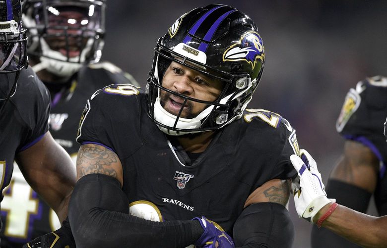 Baltimore Ravens safety Earl Thomas III reacts after intercepting a pass from New England Patriots quarterback Tom Brady during the second half of an NFL football game, Sunday, Nov. 3, 2019, in Baltimore. (AP Photo/Nick Wass)