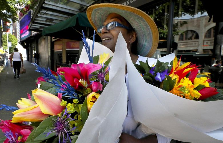 Lisa Calloway has her arms filled with two bouquets from the Pike Place Market–one for herself and one for her daughter.  Mother’s Day flower sales at the Pike Place Market continues Sunday with forty outdoor stands on the cobblestones.

Ref to more photos online.

Saturday May 11, 2019 210236 210236