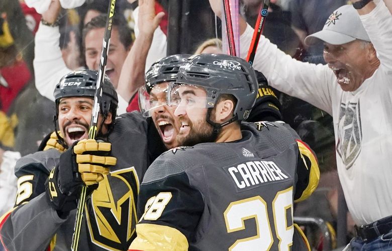 Vegas Golden Knights right wing Keegan Kolesar, center, celebrates after scoring against the Colorado Avalanche during the second period in Game 6 of an NHL hockey Stanley Cup second-round playoff series Thursday, June 10, 2021, in Las Vegas. (AP Photo/John Locher) NVJL115