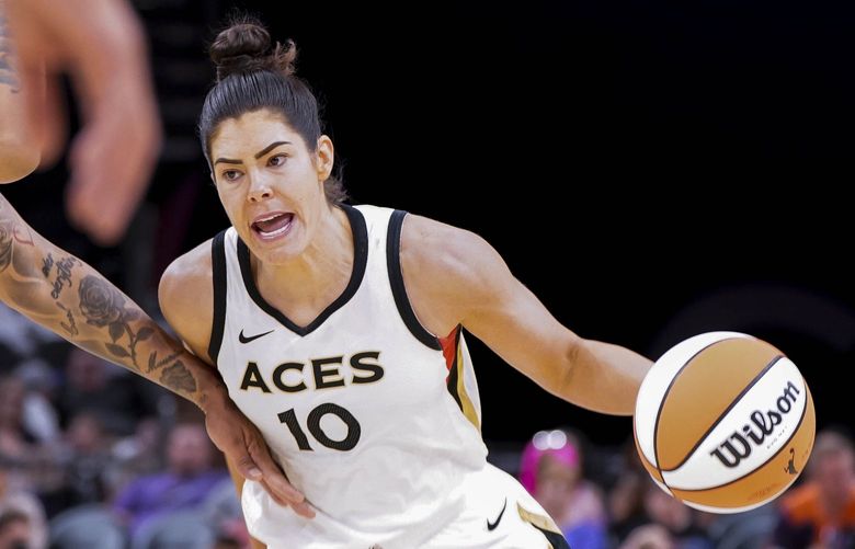 Las Vegas Aces’ Kelsey Plum (10) dribbles up court during a WNBA basketball game against the Phoenix Mercury Friday, May 6, 2022, in Phoenix. (AP Photo/Darryl Webb) NYOTK NYOTK