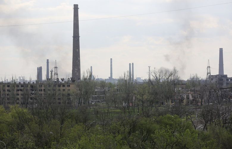 Smoke rises from the Metallurgical Combine Azovstal in Mariupol, in territory under the government of the Donetsk People’s Republic, eastern Ukraine, Wednesday, May 4, 2022. (AP Photo/Alexei Alexandrov) MAR112 MAR112
