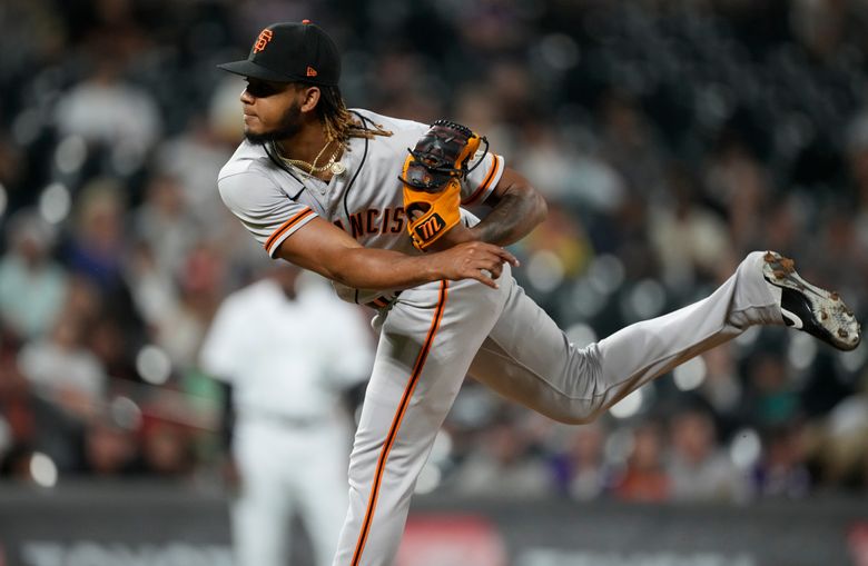 San Francisco Giants starting pitcher John Brebbia throws to the plate  during the first inning of a baseball game against the Los Angeles Dodgers  Tuesday, Sept. 6, 2022, in Los Angeles. (AP