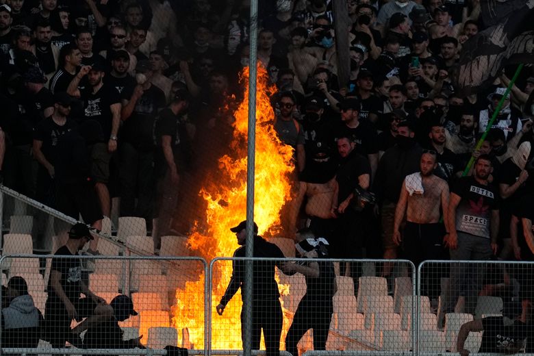 FK Tirana ultras storm pitch and attack officials after late