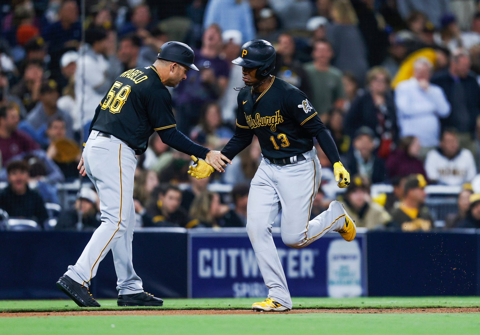 San Diego Padres' Luke Voit scores on a sacrifice fly by Austin