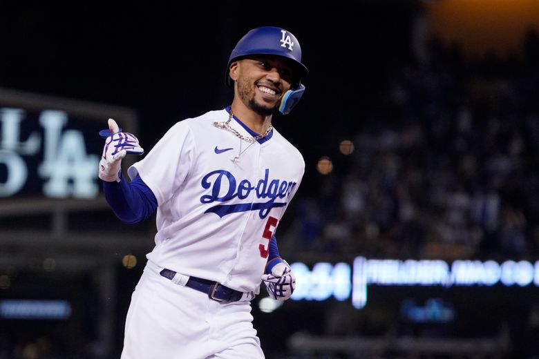 Mookie Betts of the Los Angeles Dodgers celebrates after catching