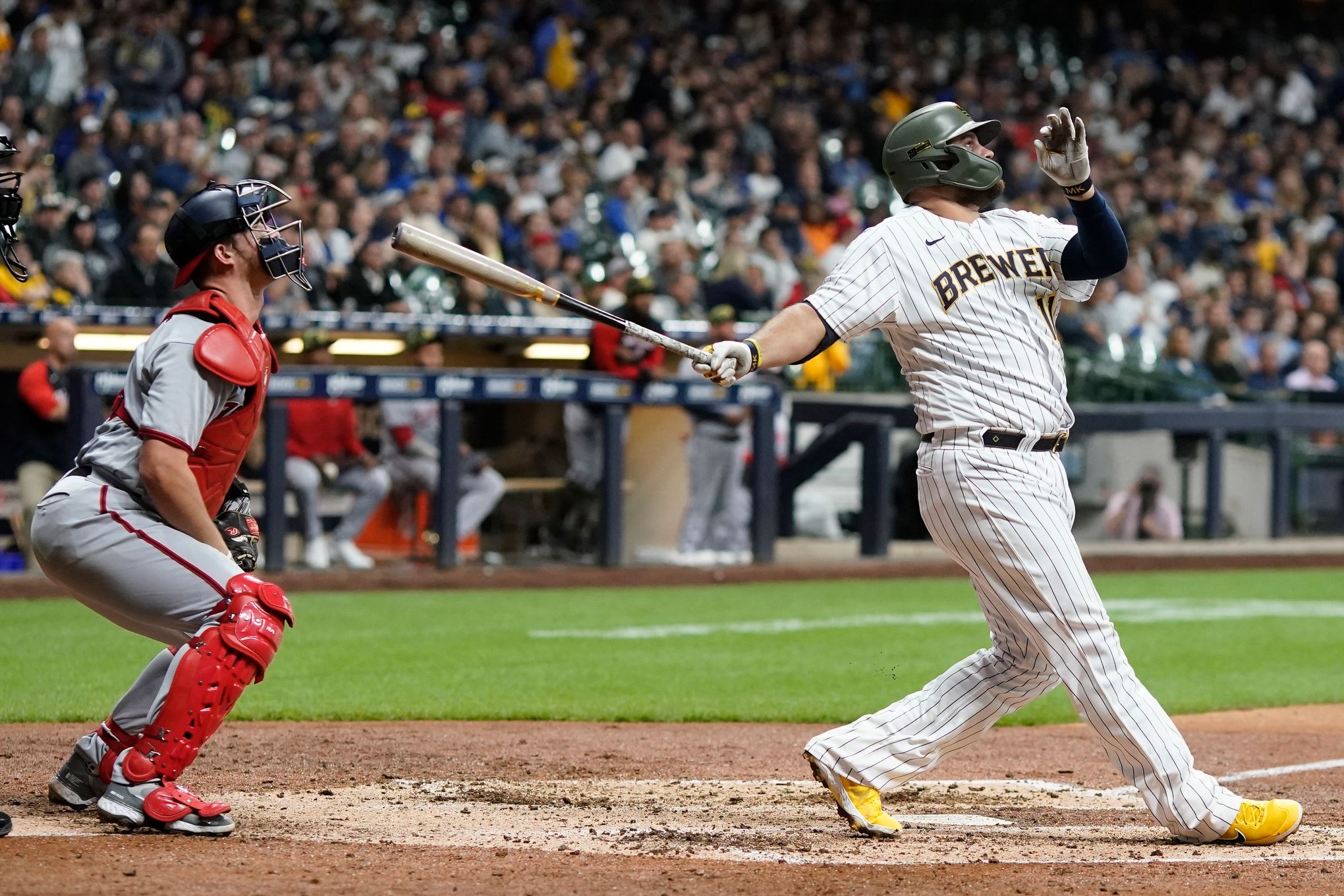 Milwaukee Brewers designated hitter Andrew McCutchen reacts as he