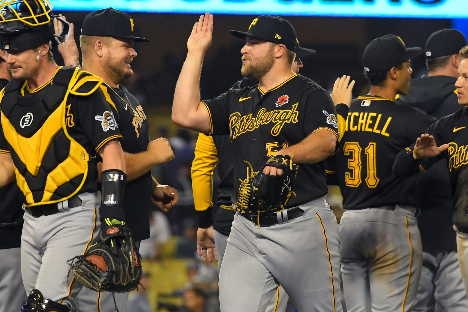 Los Angeles Dodgers' infielder Max Muncy celebrates with teammate