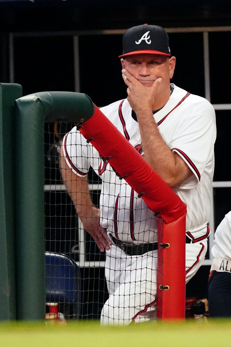 Atlanta Braves manager Brian Snitker watches from the dugout