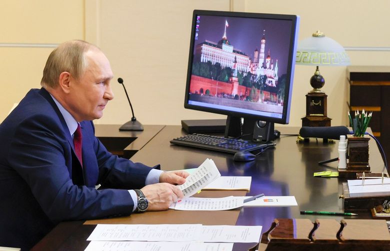 Russian President Vladimir Putin attends a meeting with families awarded Orders of Parental Glory via videoconference at the Novo-Ogaryovo residence outside Moscow, Russia, Wednesday, June 1, 2022. (Mikhail Metzel, Sputnik, Kremlin Pool Photo via AP) XAZ129
