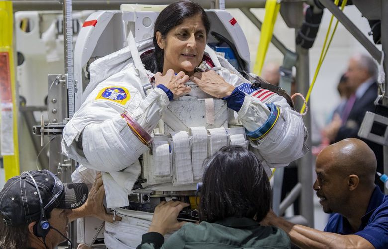 NASA commercial crew astronaut Suni Williams gets in her spacesuit as she prepares for spacewalk practice in NASA’s Neutral Buoyancy Laboratory pool in Houston on Nov. 29, 2018. MUST CREDIT: Washington Post photo by Jonathan Newton.