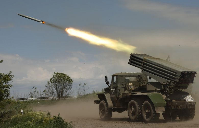 A Donetsk People’s Republic militia’s multiple rocket launcher fires from its position not far from Panteleimonivka, in territory under the government of the Donetsk People’s Republic, eastern Ukraine, Saturday, May 28, 2022. (AP Photo/Alexei Alexandrov) XAZ117 XAZ117