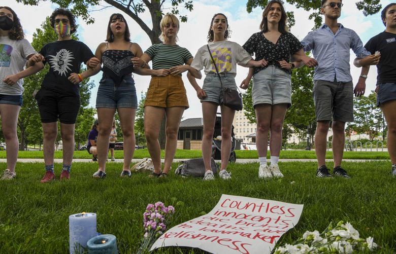 **EMBARGO: No electronic distribution, Web posting or street sales before 3:01 a.m. ET Thursday, June 2, 2022. No exceptions for any reasons. EMBARGO set by source.** Demonstrators for gun control in Washington hold a vigil for victims of the shootings in Buffalo, N.Y., and Uvalde, Texas, May 28, 2022. Six of the nine deadliest mass shootings in the United States since 2018 were by people who were 21 or younger, representing a shift for mass casualty shootings. (Kenny Holston/The New York Times) XNYT145 XNYT145