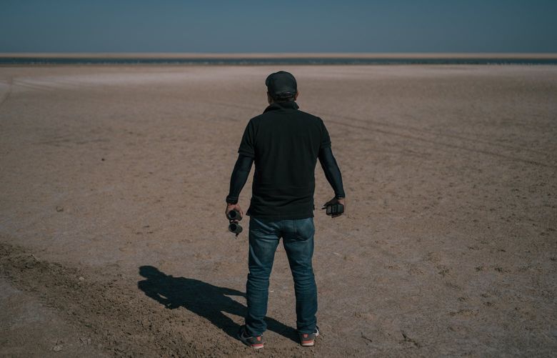 Moises, with the Baja California International Liaison Unit, stands on a beach in the village of San Felipe, Mexico, while searching in October for a fugitive American couple. The International Liaison Unit is also known as the Gringo Hunters. The unit members’ last names are being withheld so they can continue to work undercover. MUST CREDIT: Photo for The Washington Post by Luis Antonio Rojas.