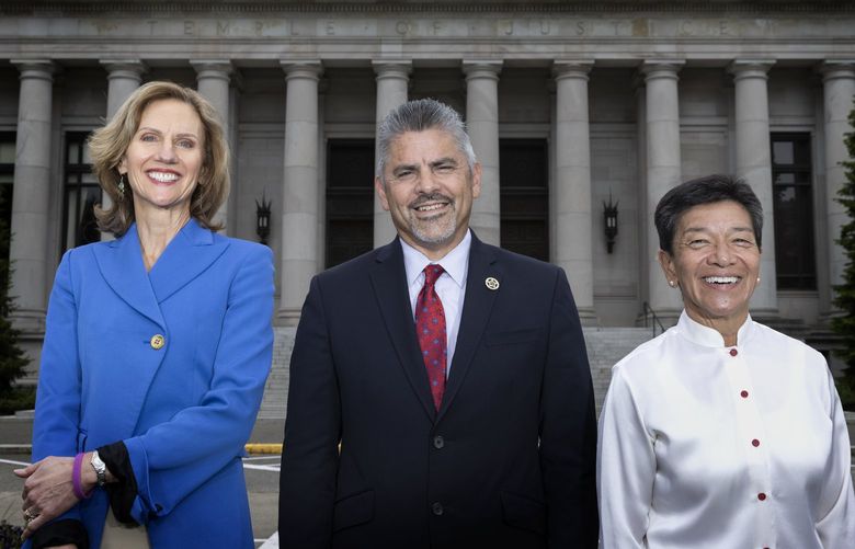 Washington State Supreme Court Justices — (L-R) Justice Debra Stephens, Chief Justice Steven González and Justice Mary Yu, stand in front of the Temple of Justice at the Washington State Capitol in Olympia Wednesday, June 1, 2022.

Two years ago the nine justices on the Washington state Supreme Court wrote a remarkable letter calling on the legal community to have the “courage and will” to better address racism in the legal system.

The Supreme Court, which normally only answers the legal questions presented to it, went out of its way to call on lawyers, judges and courts across the state to do more to address racism. 220436