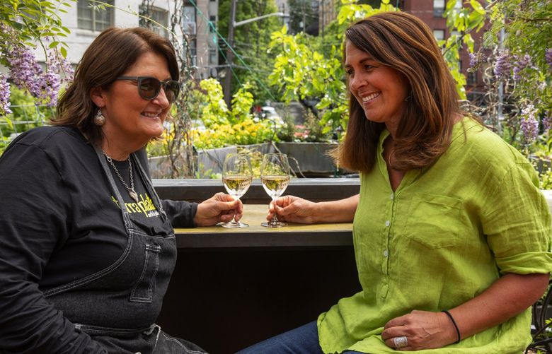 Terra Plata restaurant’s power couple: chef Tamara Murphy, left, and manager Linda Di Lello Morton at the roof deck garden, Monday, June 6, 2022 in Seattle.
