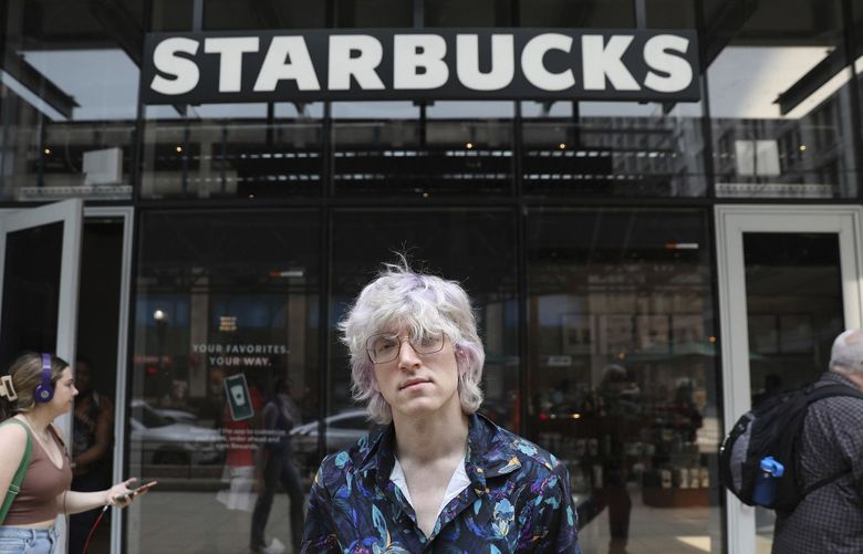 Starbucks barista Brick Zurek, standing in front of the downtown Starbucks on Wabash Avenue, on May 11, 2022, has been organizing for union representation with Starbucks Workers United. In an election Tuesdays, employees voted against joining the union. (Chris Sweda/Chicago Tribune/TNS) 49967876W 49967876W