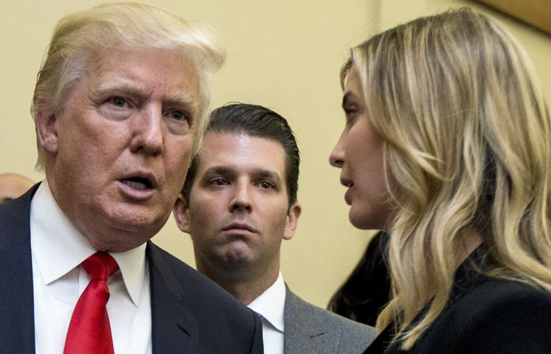 FILE – Donald Trump, left, his son Donald Trump Jr., center, and his daughter Ivanka Trump speak during the unveiling of the design for the Trump International Hotel in the The Old Post Office, in Washington, on  Sept. 10, 2013. The former, his namesake son and his daughter have agreed to answer questions under oath next month in the New York attorney general’s civil investigation into his business practices, unless their lawyers persuade the state’s highest court to step in. A Manhattan judge signed off Wednesday, June 8, 2022, on an agreement that calls for the Trumps to give depositions â€” a legal term for sworn, pretrial testimony out of court â€” starting July 15. (AP Photo/Manuel Balce Ceneta, File) NYRD313 NYRD313