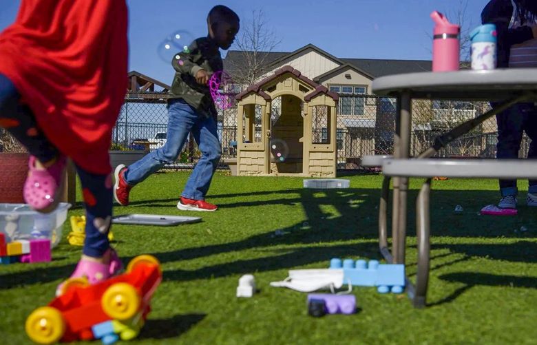 Children play on the playground of a daycare center in Richmond, Texas, U.S., on Wednesday, Feb. 9, 2022. Since Covid-19 arrived in earnest in early 2020, about one-third of childcare centers have closed and some 111,000 workers have departed the sector.