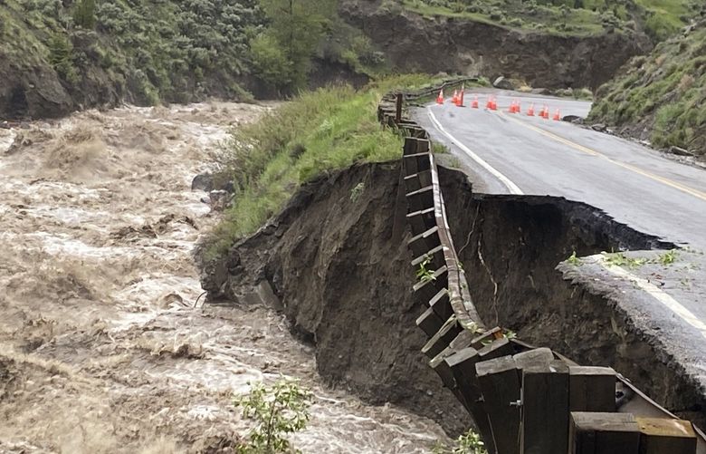 In this photo provided by the National Park Service, is high water in the Gardiner River along the North Entrance to Yellowstone National Park in Montana, that washed out part of a road on Monday, June 13, 2022. (National Park Service via AP) FX105 FX105
