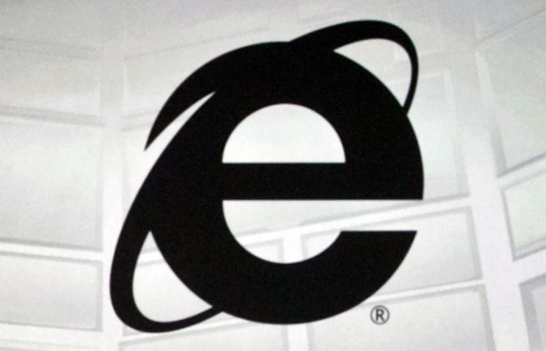 FILE – The Microsoft Internet Explorer logo is projected on a screen during a Microsoft Xbox E3 media briefing in Los Angeles, June 4, 2012. As of Wednesday, June 15, 2022, Microsoft will no longer support the once-dominant browser that legions of web surfers loved to hate and a few still claim to adore. (AP Photo/Damian Dovarganes, File) NYSB223 NYSB223