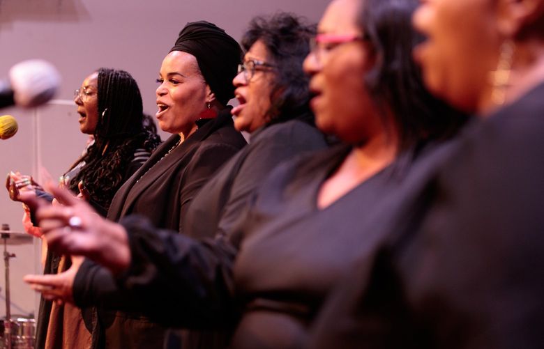 The Northwest African American Museum’s choir, the African American Cultural Ensemble (ACE), practices in Seattle Sunday, June 5, 2022. Liah Walker, second from left, says joining the choir has been a blessing for her and fellow members. “ACE came about in a very, very critical moment in our country,” says Walker. “When we began this journey we were in the middle of the pandemic. We had just experienced so much violence against people of color. And, ACE came at a time where I think we really needed something that was going to allow us to just release some of the tension and some of the pain.” 220618